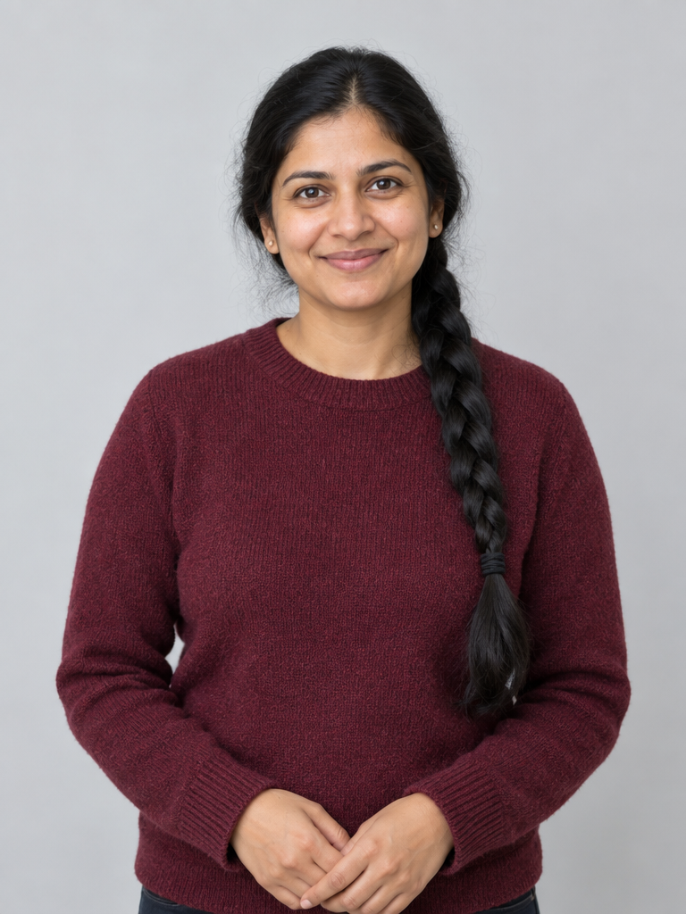Clear waist-up reference portrait of a fictional adult woman in a burgundy sweater